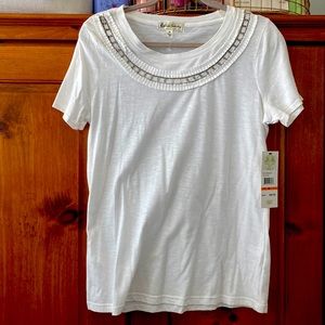 White tee with embellishments in the front